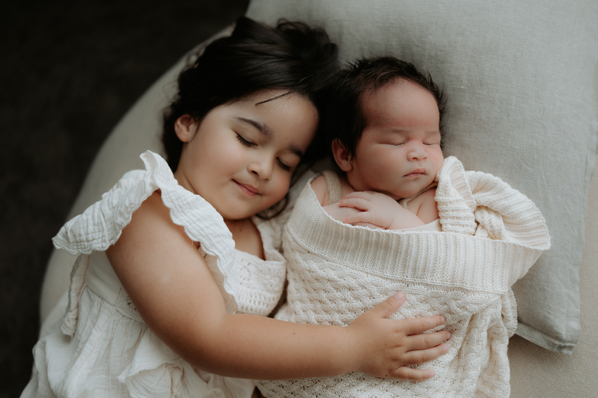 Photo of newborn baby with 3 year old sister